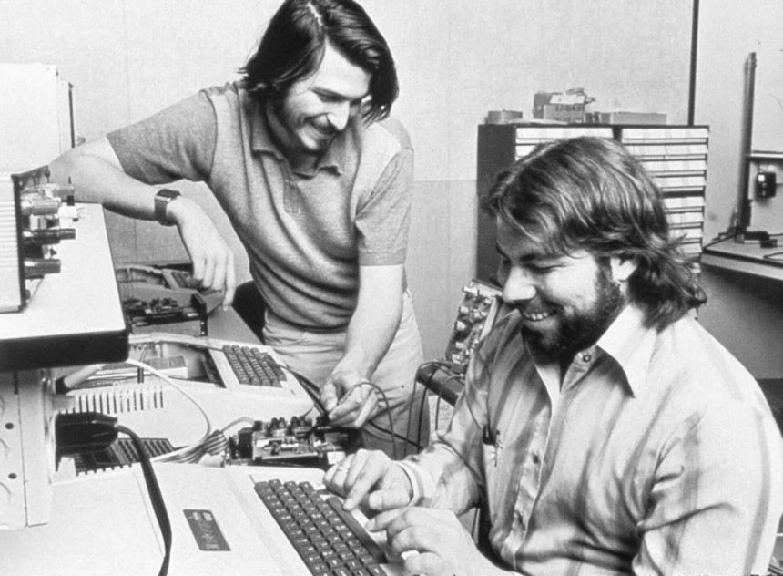 Steve Wozniak and Steve Jobs working on the Apple II